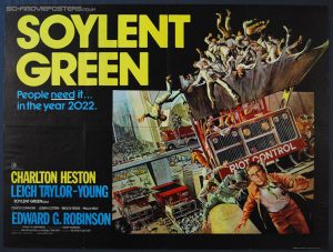 Soylent Green movie poster showing crowds of people being scooped up by bulldozers